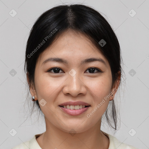 Joyful asian young-adult female with medium  brown hair and brown eyes