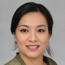 Joyful asian young-adult female with medium  brown hair and brown eyes