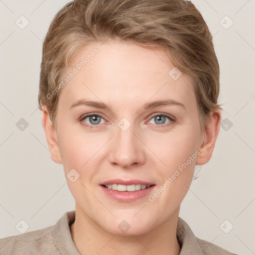 Joyful white young-adult female with short  brown hair and grey eyes