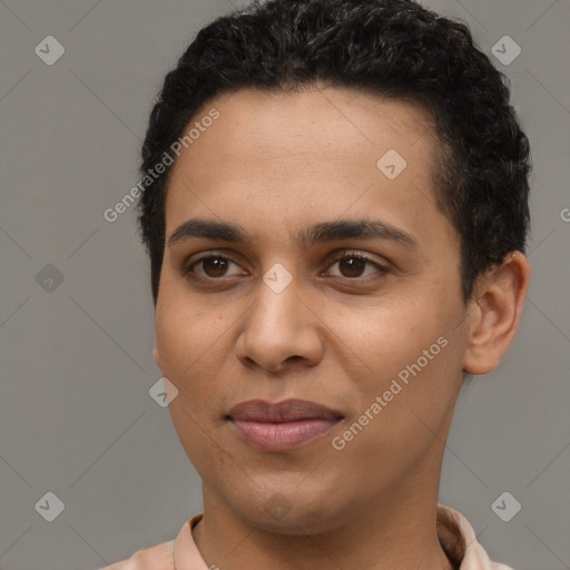 Joyful latino young-adult male with short  brown hair and brown eyes