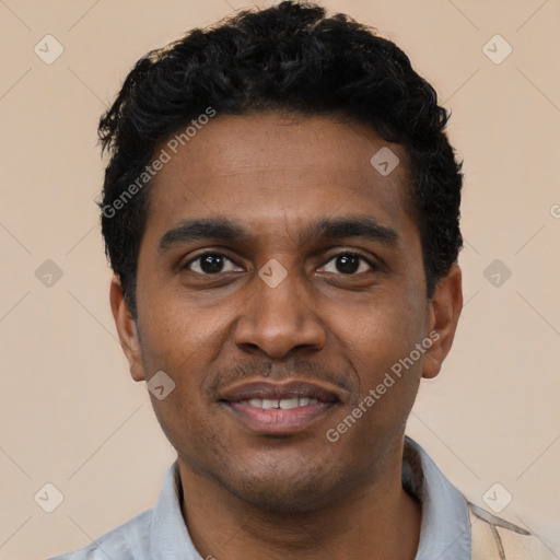 Joyful black young-adult male with short  black hair and brown eyes