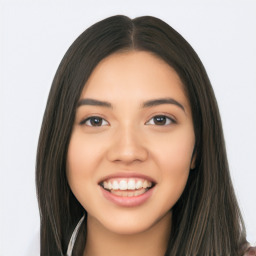 Joyful latino young-adult female with long  black hair and brown eyes