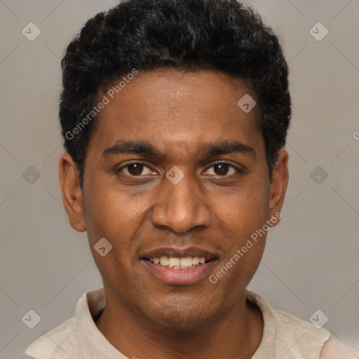 Joyful black young-adult male with short  black hair and brown eyes