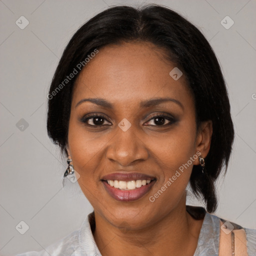 Joyful black adult female with medium  black hair and brown eyes