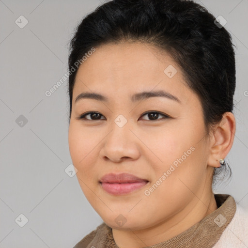 Joyful asian young-adult female with short  brown hair and brown eyes