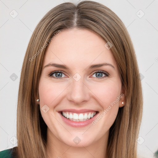 Joyful white young-adult female with long  brown hair and green eyes