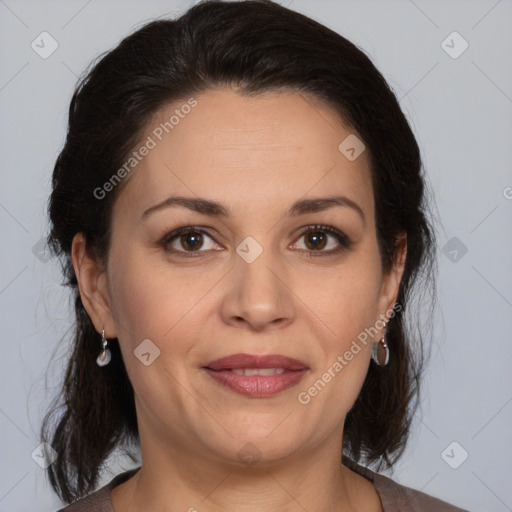 Joyful white adult female with medium  brown hair and brown eyes