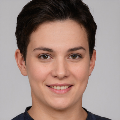 Joyful white young-adult female with short  brown hair and brown eyes