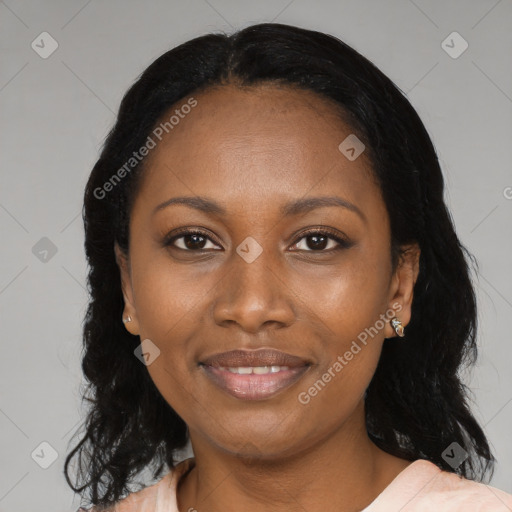 Joyful black adult female with medium  black hair and brown eyes