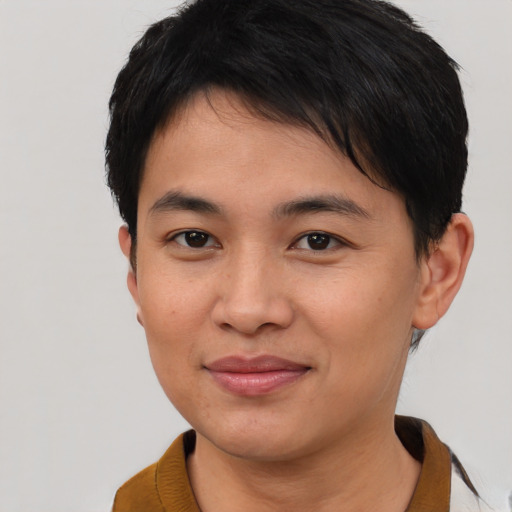 Joyful asian young-adult female with short  brown hair and brown eyes