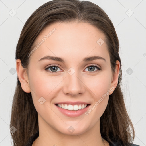 Joyful white young-adult female with long  brown hair and grey eyes