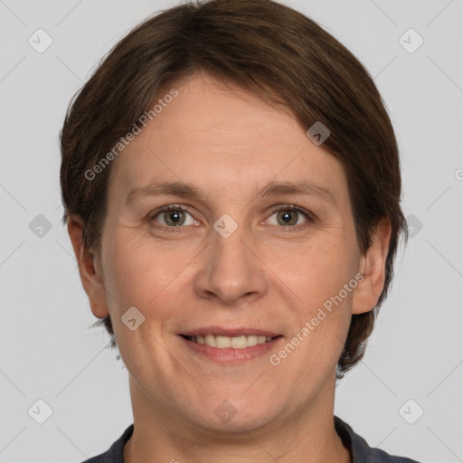 Joyful white adult female with short  brown hair and grey eyes