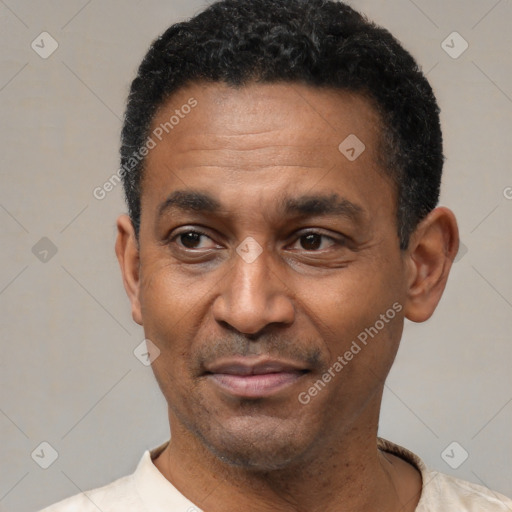 Joyful latino adult male with short  black hair and brown eyes