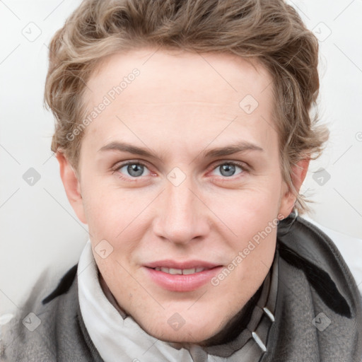 Joyful white young-adult female with short  brown hair and blue eyes