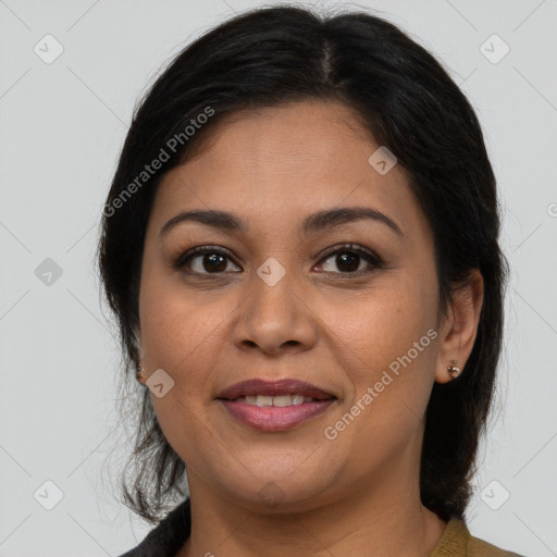 Joyful latino young-adult female with medium  brown hair and brown eyes