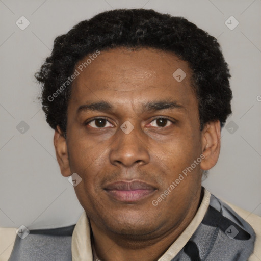 Joyful black adult male with short  black hair and brown eyes