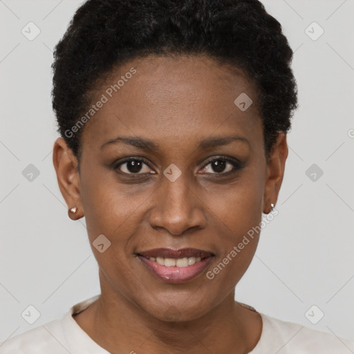 Joyful black young-adult female with short  black hair and brown eyes