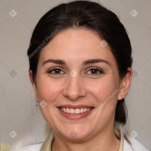 Joyful white adult female with medium  brown hair and brown eyes