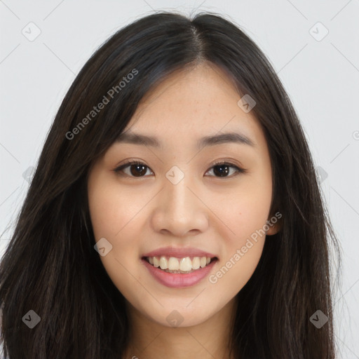 Joyful asian young-adult female with long  brown hair and brown eyes