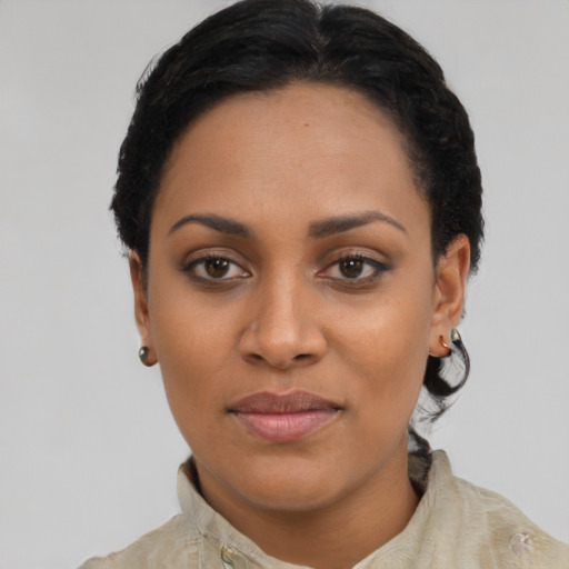 Joyful asian young-adult female with short  black hair and brown eyes