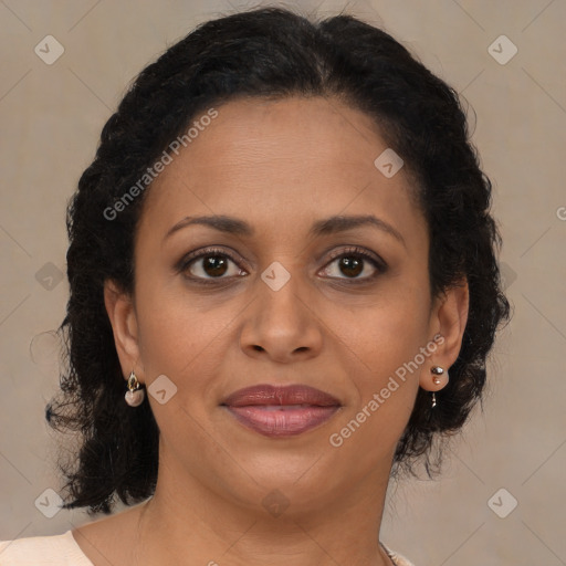 Joyful black adult female with medium  brown hair and brown eyes