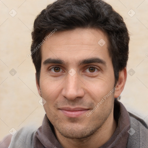 Joyful white young-adult male with short  black hair and brown eyes