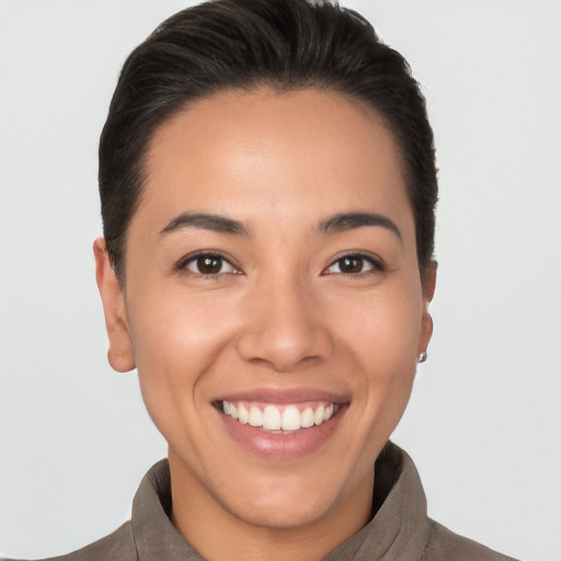 Joyful white young-adult female with short  brown hair and brown eyes