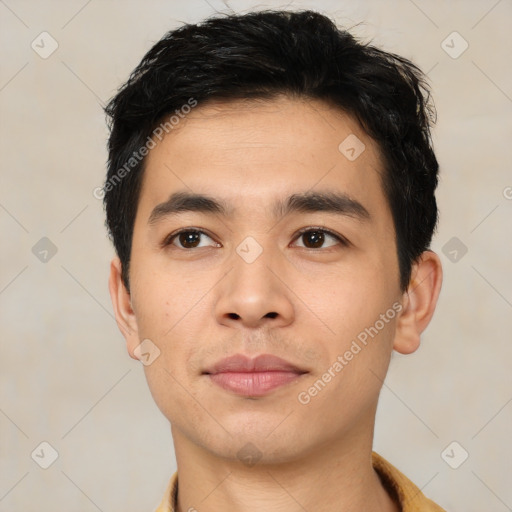 Joyful asian young-adult male with short  black hair and brown eyes