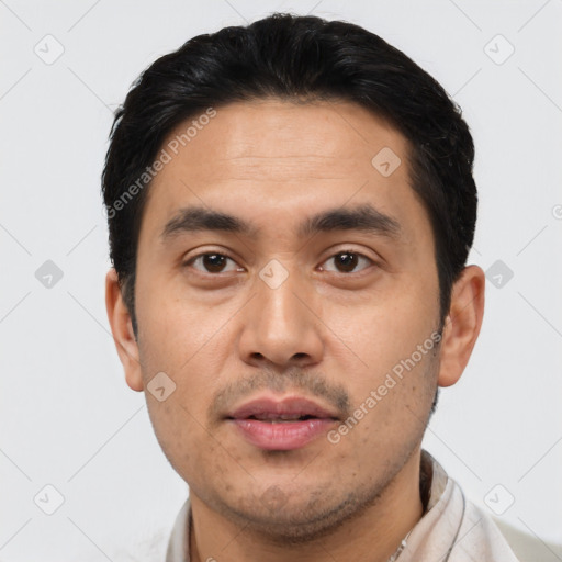 Joyful asian young-adult male with short  black hair and brown eyes