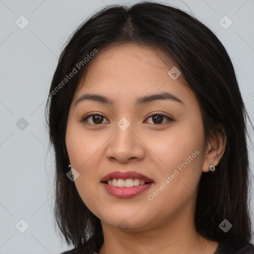 Joyful asian young-adult female with long  brown hair and brown eyes