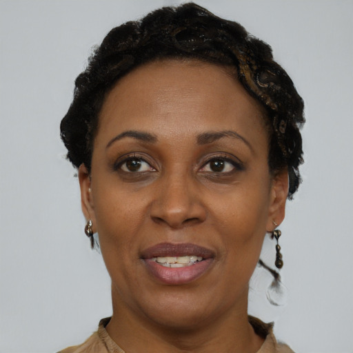 Joyful black adult female with short  brown hair and brown eyes