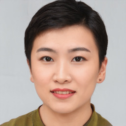 Joyful asian young-adult female with short  brown hair and brown eyes