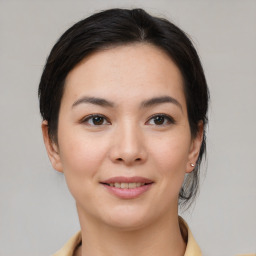 Joyful asian young-adult female with medium  brown hair and brown eyes