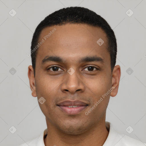 Joyful black young-adult male with short  black hair and brown eyes