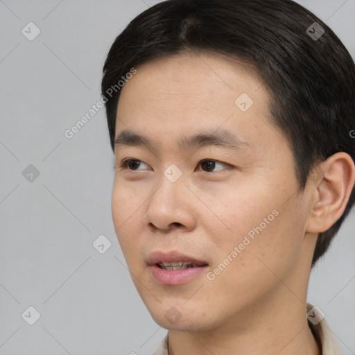 Neutral asian young-adult male with short  black hair and brown eyes