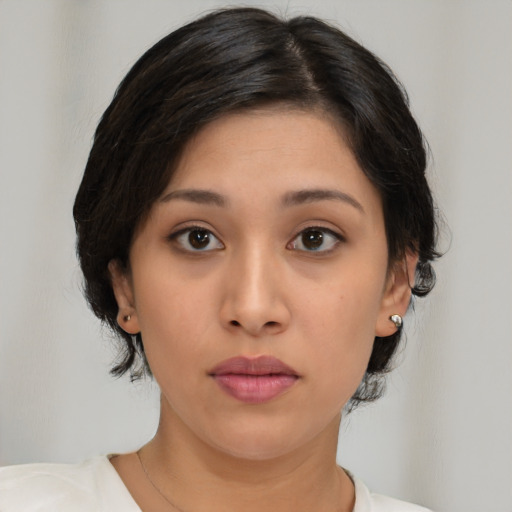 Neutral asian young-adult female with medium  brown hair and brown eyes