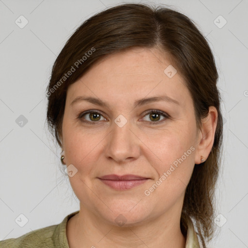 Joyful white adult female with medium  brown hair and grey eyes