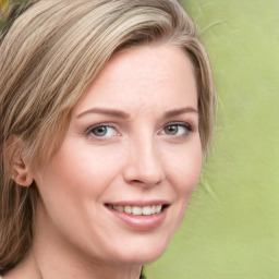 Joyful white young-adult female with medium  brown hair and green eyes