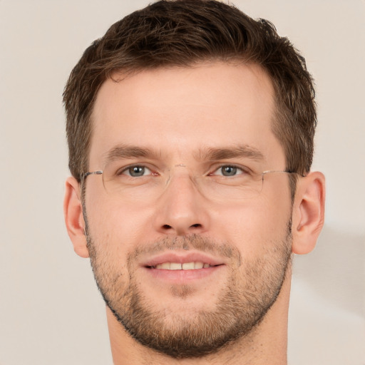 Joyful white young-adult male with short  brown hair and brown eyes