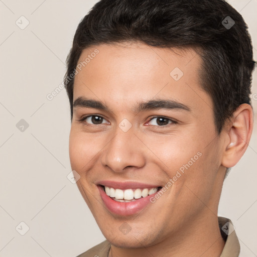 Joyful white young-adult male with short  brown hair and brown eyes