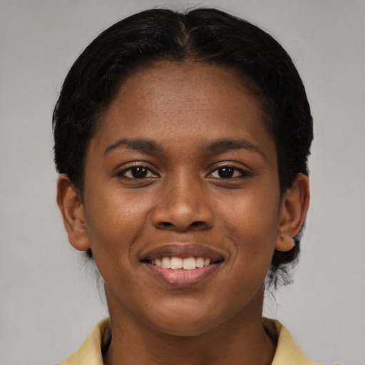 Joyful latino young-adult female with short  brown hair and brown eyes