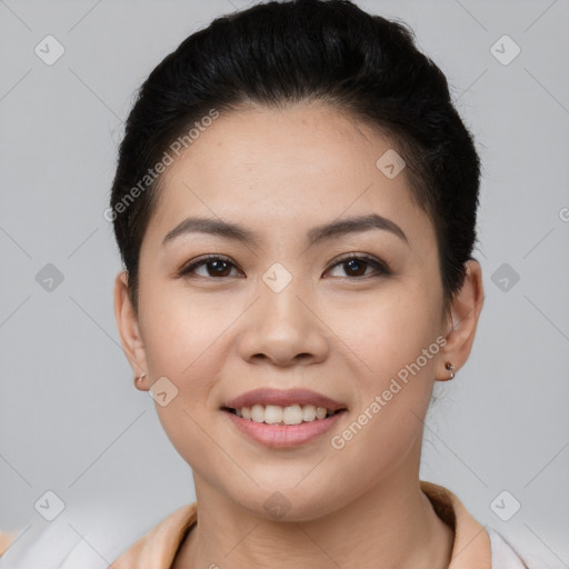 Joyful asian young-adult female with short  brown hair and brown eyes