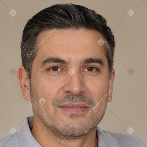 Joyful white adult male with short  brown hair and brown eyes