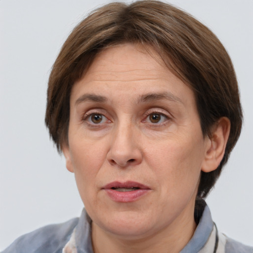 Joyful white adult female with short  brown hair and brown eyes