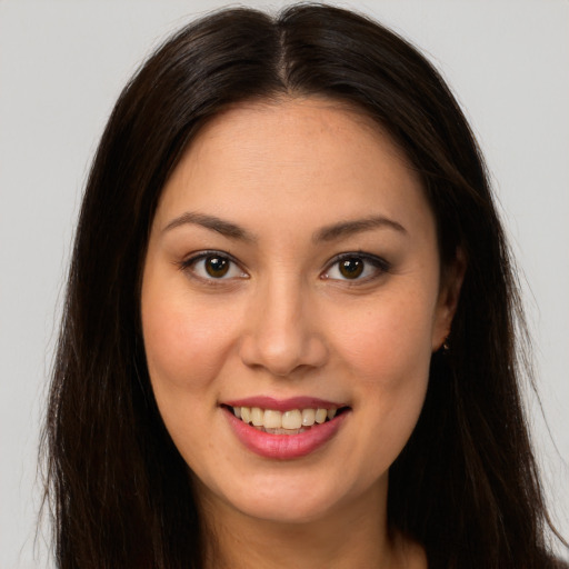 Joyful white young-adult female with long  brown hair and brown eyes