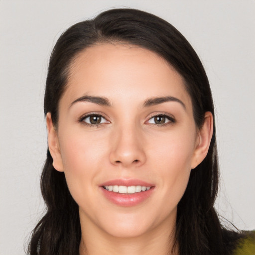 Joyful white young-adult female with long  brown hair and brown eyes