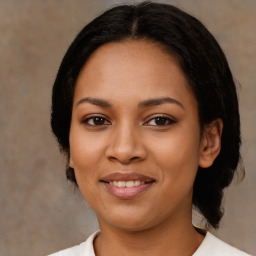 Joyful latino young-adult female with medium  black hair and brown eyes