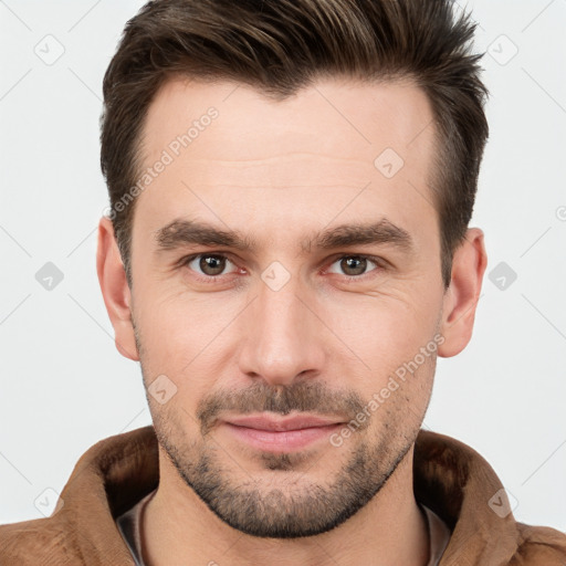 Joyful white young-adult male with short  brown hair and brown eyes