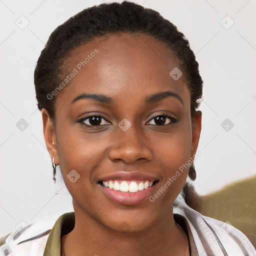 Joyful black young-adult female with short  brown hair and brown eyes