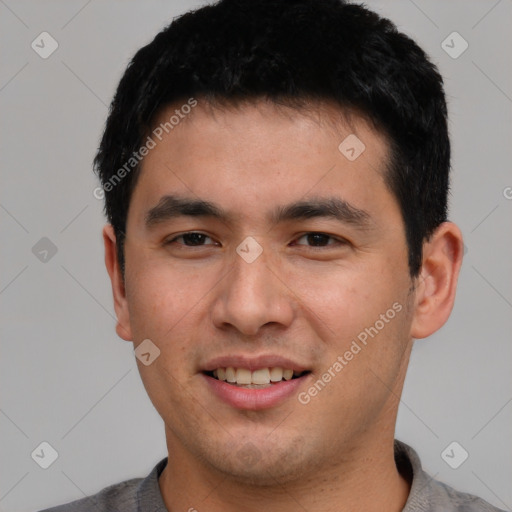 Joyful white young-adult male with short  black hair and brown eyes